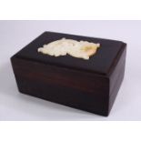 A CHINESE WHITE JADE MOUNTED HARDWOOD BOX, The jade carved in chilong form, 15cm wide x 10cm.