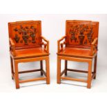 A GOOD PAIR OF CHINESE HARDWOOD & LACQUER CARVED ARM CHAIRS, the backs with floral display lacquer