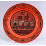 A 19TH / 20TH CENTURY INDIAN LACQUER PLATE, with scenes of figures and buildings, 26cm