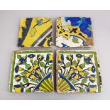 A COLLECTION OF FOUR 17TH / 18TH CENTURY PERSIAN SAFAVID POTTERY TILES, each with varying decor of