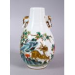 A CHINESE REPUBLIC STYLE FAMILLE ROSE TWIN HANDLE PORCELAIN VASE, decorated with a deer amongst a