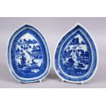 A PAIR OF 18TH CENTURY CHINESE BLUE & WHITE PORCELAIN LEAF SHAPED DISHES, decorated with native