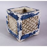 A 19TH / 20TH CENTURY CHINESE BLUE & WHITE PORCELAIN OPENWORK POT, with floral decoration