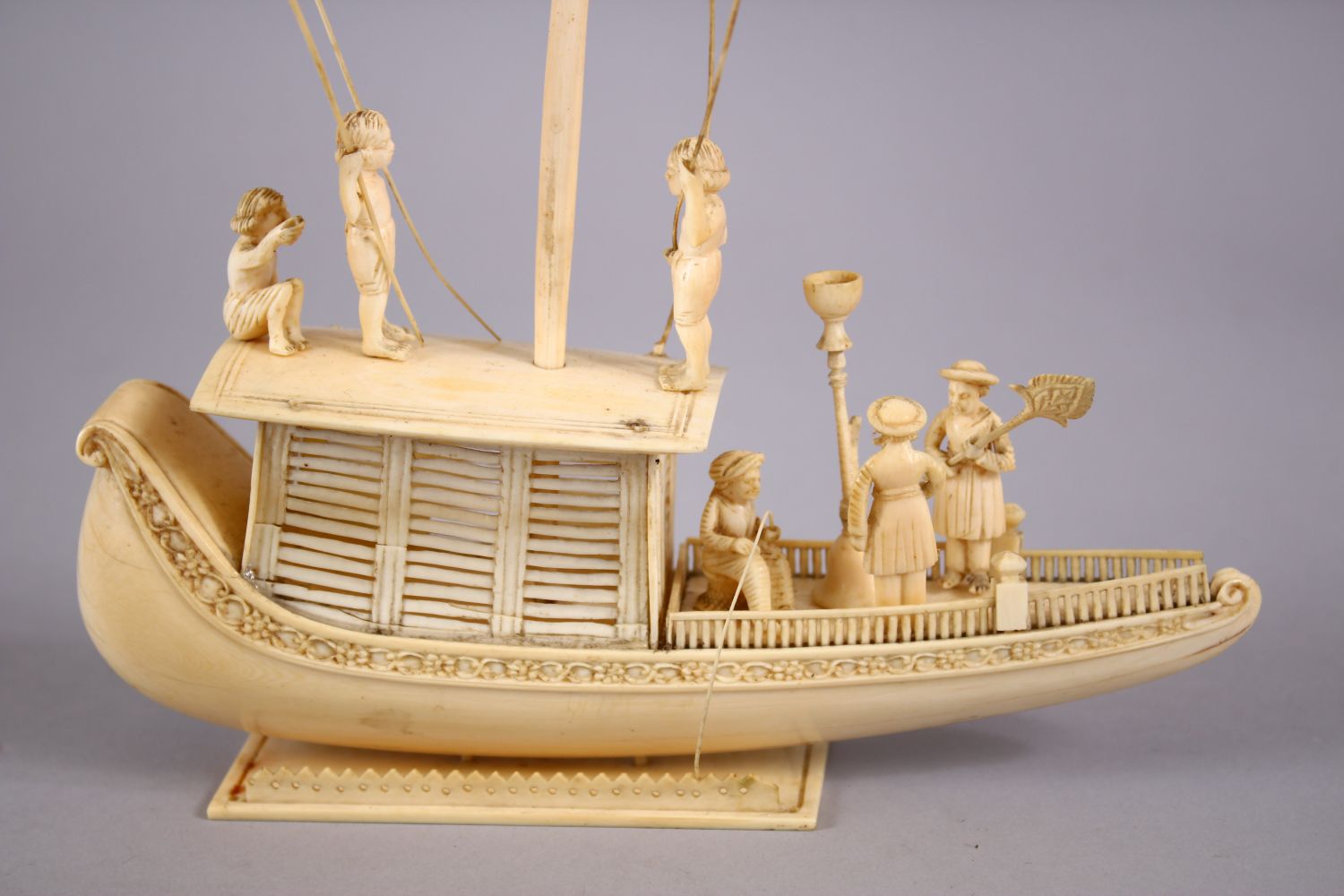 A FINELY CARVED 19TH CENTURY INDIAN IVORY BOAT WITH FISHERMEN, with fine strands of sails, six - Image 3 of 11