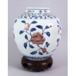 A FINE CHINESE UNDERGLAZE BLUE & COPPER RED PORCELAIN JAR & STAND, the jar with underglaze blue