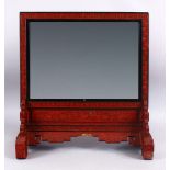 A FINE 19TH CENTURY CHINESE CINNABAR LACQUER SHOU DECORATED TABLE MIRROR, the mirror finely carved