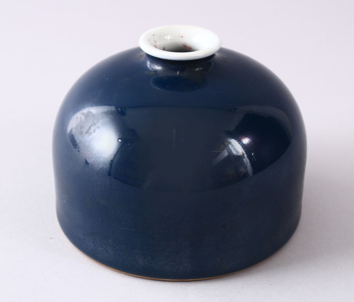 A CHINESE KANGXI STYLE POWDER BLUE PORCELAIN BRUSH WASH, the base with a six character kangxi