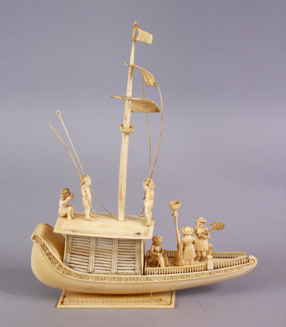 A FINELY CARVED 19TH CENTURY INDIAN IVORY BOAT WITH FISHERMEN, with fine strands of sails, six - Image 2 of 11