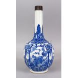 A GOOD CHINESE BLUE & WHITE PORCELAIN BOTTLE VASE, with panels of native flora and lion dogs, around