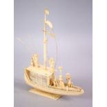 A FINELY CARVED 19TH CENTURY INDIAN IVORY BOAT WITH FISHERMEN, with fine strands of sails, six