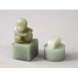 TWO GOOD CHINESE CARVED JADE SEALS, one depicting a monkey crouched amongst his nut, the base carved
