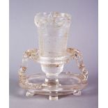 A CHINESE CARVED GLASS LIBATION CUP & STAND, the stand with an opening supported by chilong, the