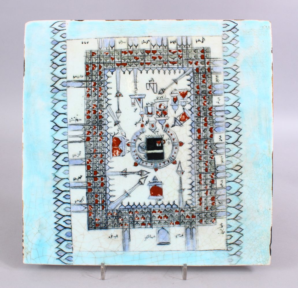 A LARGER ISLAMIC KABE POTTERY TILE, with a pale turquoise glaze, central decoration with Arabic