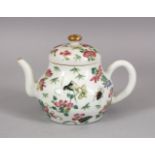 A CHINESE FAMILLE ROSE PORCELAIN TEA POT AND COVER, decorated with insects and sprays of native