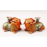 A GOOD PAIR OF 19TH CENTURY CHINESE CANTON FAMILLE ROSE PORCELAIN JOSS STICK HOLDERS, both lion dogs