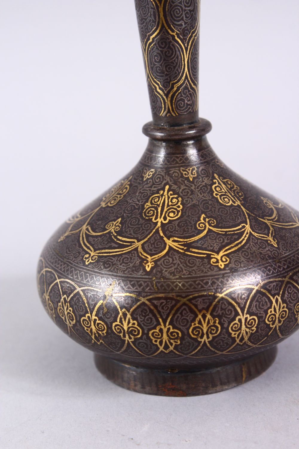 AN 18TH / 19TH CENTURY ISLAMIC GOLD INLAID STEEL VASE, the gold inlay with formal decoration, 13cm. - Image 3 of 4