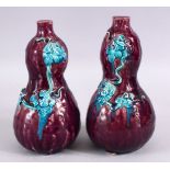 A PAIR OF POSSIBLY 19TH CENTURY CHINESE AUBERGINE GLAZED PORCELAIN DOUBLE GOURD VASES, each with