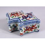 A CHINESE WUCAI DECORATED PORCELAIN DRAGON BOX, decorated with scenes of a dragons chasing the