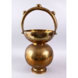A LARGE 19TH / 20TH CENTURY ISLAMIC BRASS SPITTOON, with figures and raised bosses, 56cm x 28cm.