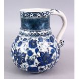 AN ISLAMIC BLUE & WHITE PORCELAIN WATER JUG, decorated with formal scrolling flora, 20cm high.