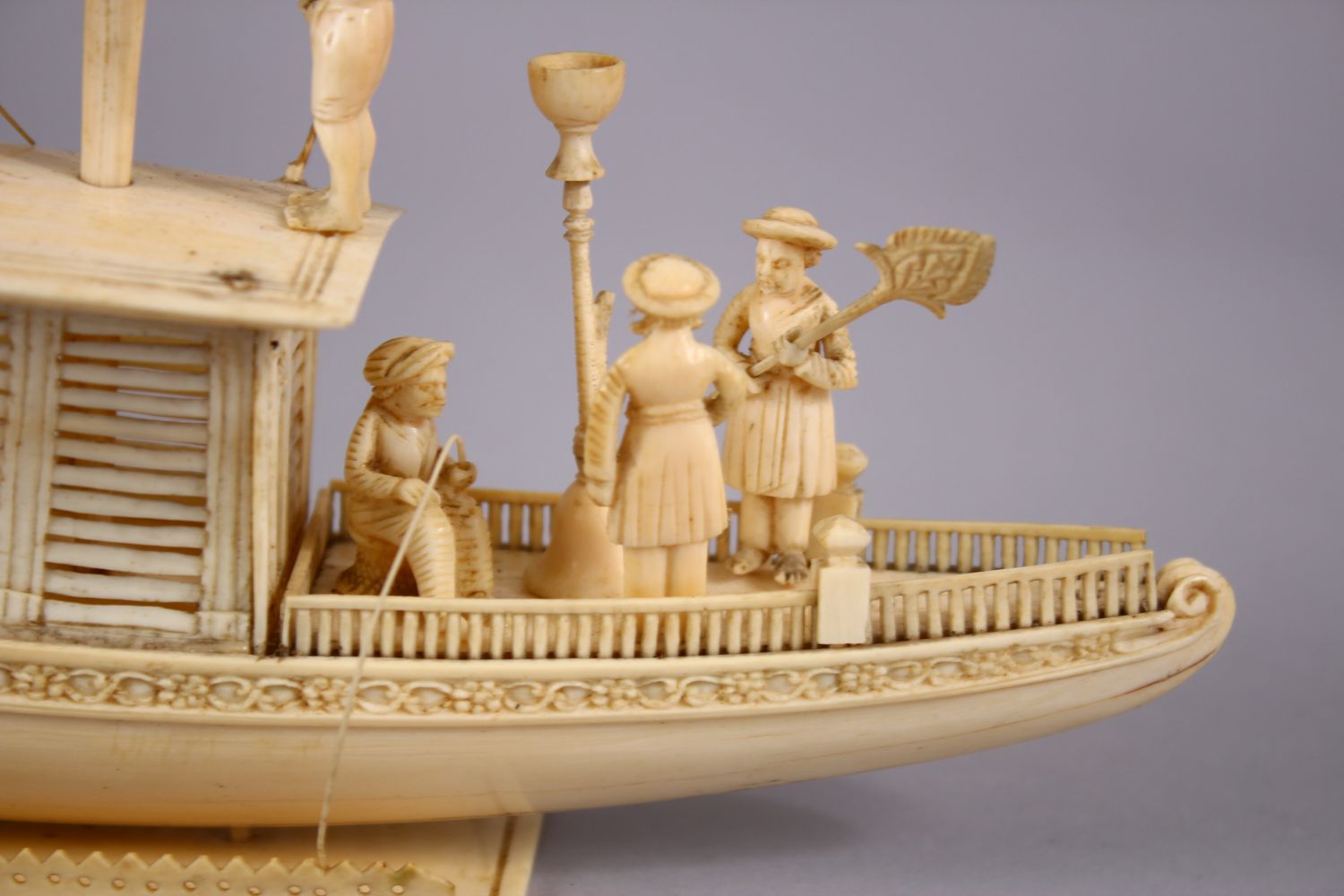 A FINELY CARVED 19TH CENTURY INDIAN IVORY BOAT WITH FISHERMEN, with fine strands of sails, six - Image 4 of 11