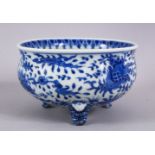 A JAPANESE MEIJI PERIOD BLUE & WHITE TRIPOD BOWL, decorated with an interior scene of a village, the