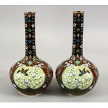 A PAIR OF JAPANESE MEIJI PERIOD BOTTLE SHAPED CLOISONNE VASES, with panel decoration of birds and
