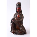 A 19TH CENTURY CHINESE CARVED WOOD & LACQUER FIGURE OF GUANYIN, in a seated position, with carved