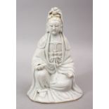 A 19TH CENTURY CHINESE BLANC DE CHINE PORCELAIN FIGURE OF GUANYIN, in a seated position holding a