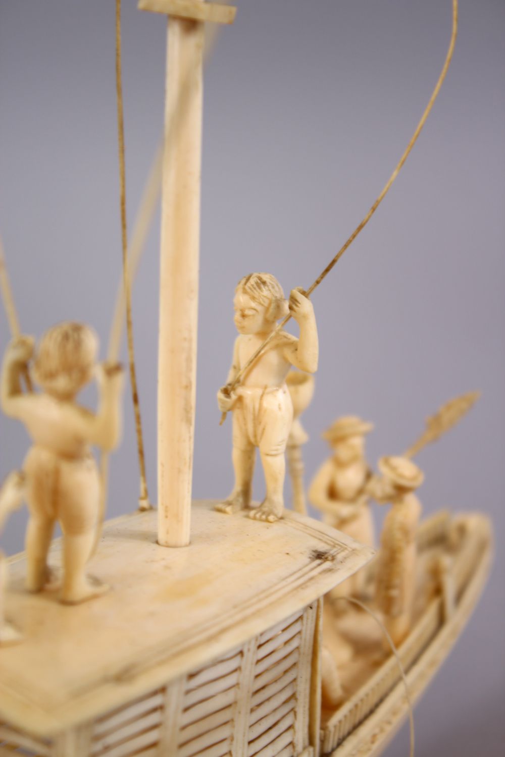 A FINELY CARVED 19TH CENTURY INDIAN IVORY BOAT WITH FISHERMEN, with fine strands of sails, six - Image 6 of 11