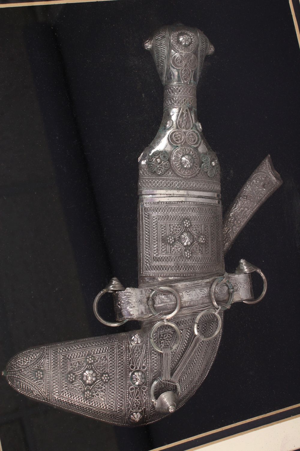 A GOOD 19TH CENTURY TURKISH KINJAL DAGGER IN A FRAME WITH A CAMEL AND OIL POURER, white metal, - Image 2 of 6