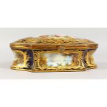 A SUPERB CONTINENTAL PORCELAIN SHAPED CASKET AND COVER, rich dark blue ground with gold