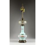 A VICTORIAN OPALINE LAMP with glass reservoir and metal mounts. 26ins high overall.