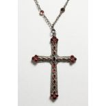 A SILVER AND GARNET CRUCIFIX ON CHAIN.