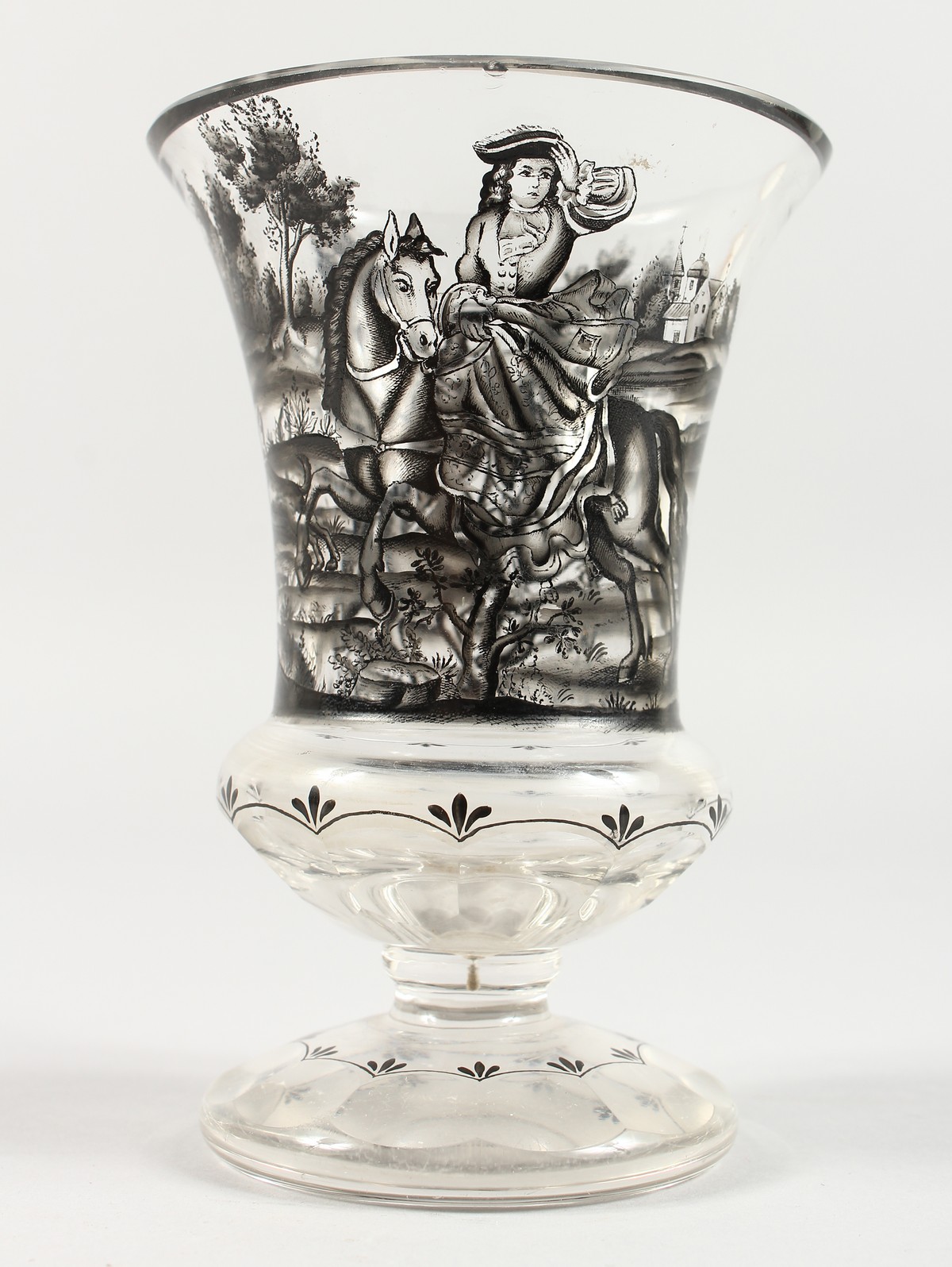 A GERMAN GLASS BEAKER painted with a hunting scene. 8.5ins high.