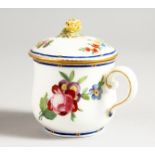 A SEVRES CUSTARD CUP AND COVER painted with flowers under a blue line and dentil gilt border.