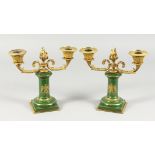 A GOOD PAIR OF LOUIS XVI PORCELAIN AND ORMOLU TWO-LIGHT CANDLESTICKS, the stems with winged eagles