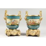 A PAIR OF IMPRESSIVE SEVRES STYLE PORCELAIN CACHE POTS with ormolu mounts and liners. 13ins high.