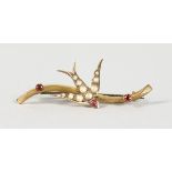 AN EDWARDIAN GOLD, PEARL AND RUBY SET BROOCH.