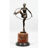 AN ART DECO STYLE BRONZE OF A DANCER on a circular marble base. 19ins high.