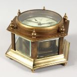 A BRASS HEXAGONAL TABLE CLOCK.