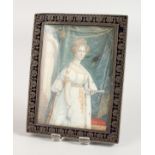 A SILVER AND ENAMEL RECTANGULAR UPRIGHT PHOTOGRAPH FRAME, portrait three-quarter length of a lady.