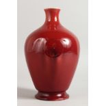 A MOORCROFT RICH RED BURSLEM VASE. 8.5ins high.