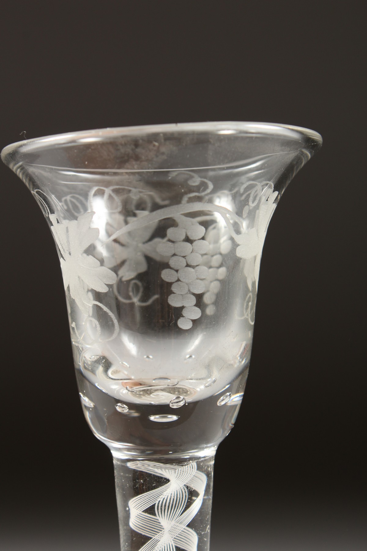 A GEORGIAN WINE GLASS, with inverted bell bowl etched with fruiting vines, with white air twist - Image 6 of 10