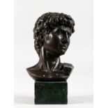 A SMALL BRONZE ROMAN STYLE BUST OF A MAN. 6.5ins high.