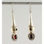 A PAIR OF SILVER AND GARNET EARRINGS.