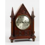 A REGENCY MAHOGANY GOTHIC DESIGN BRACKET CLOCK by GRIMALDE & JOHNSON, STRAND, with silver dial and