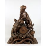 A VERY GOOD ANTIQUE BLACK FOREST CLOCK CARVED WITH TWO SAINT BERNARD DOGS, one with a bell around