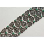 A WIDE SILVER AND MARCASITE BRACELET.