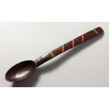 A TRIBAL SPOON. 14ins long.